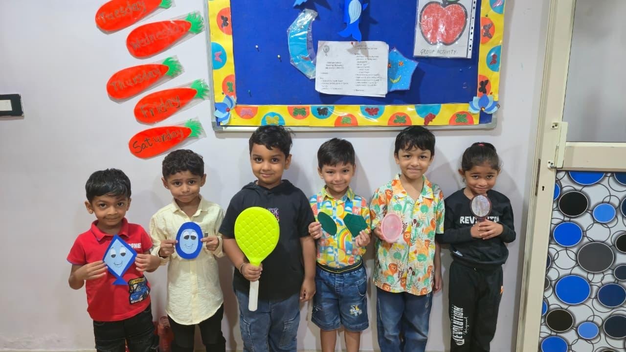 Children with classroom work at I-Kiddz